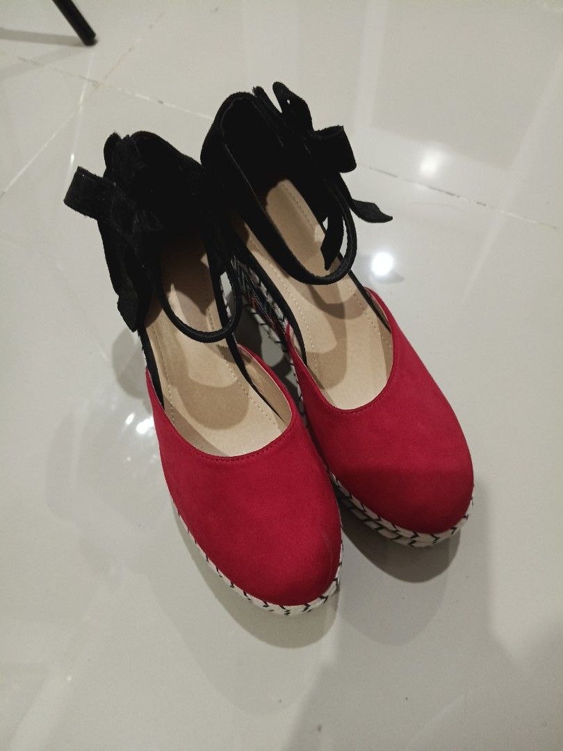 Shein Red and Black Wedge Heels (Category: Wedges) located in Makati City. Submitted by maymay829 (Listing ID 1467108478, Image 1). Description: - Red suede toe straps with black ankle wraps and a back ribbon bow - Eye-catching colorful woven Aztec geometric pattern on the wedge heel - Stylish white stitching along the platform edge - Size: CN42.