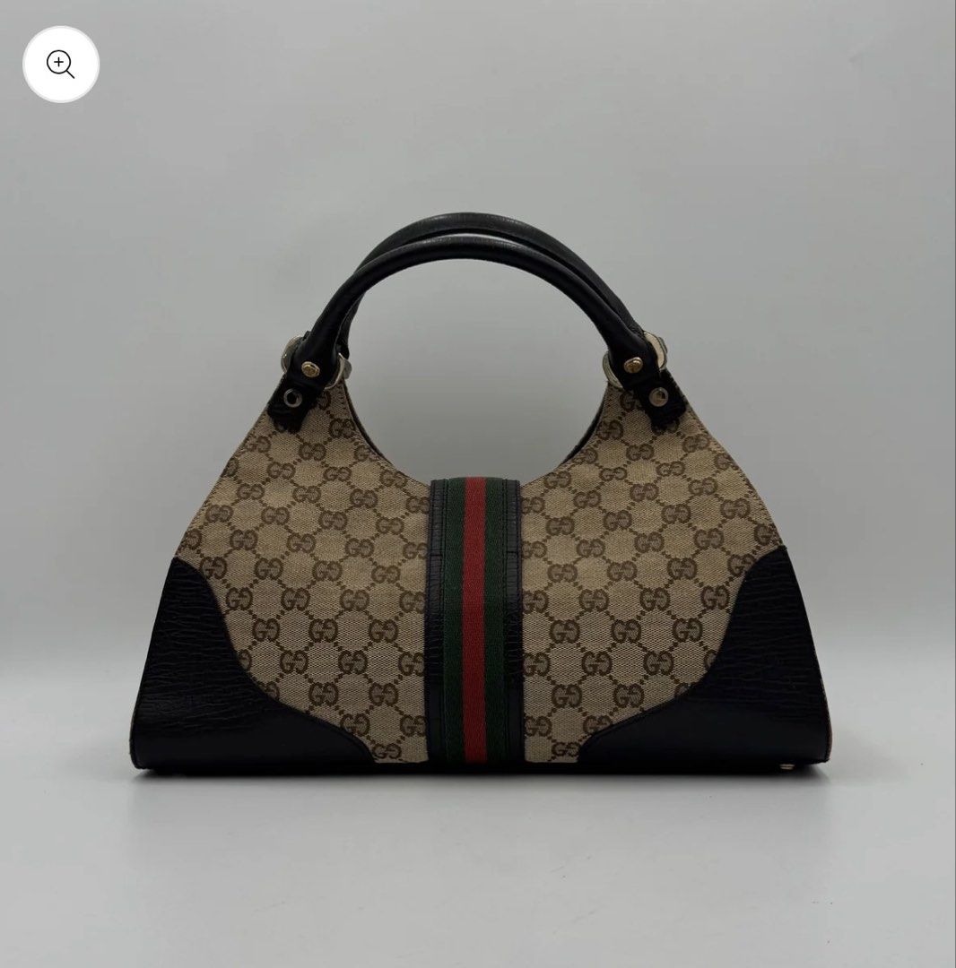 Sherry line junco shoulder bag (Category: Luxury Bags & Wallets) located in Manila. Submitted by angelavict42605 (Listing ID 1467143027, Image 2). Description: - Authentic Gucci hobo bag in beige/ebony GG canvas - Iconic green and red web stripe with black leather trim - Silver-tone hardware and buckle accent - Single leather shoulder strap for easy wear - Clean interior and exterior with serial number tag (130995 467891).