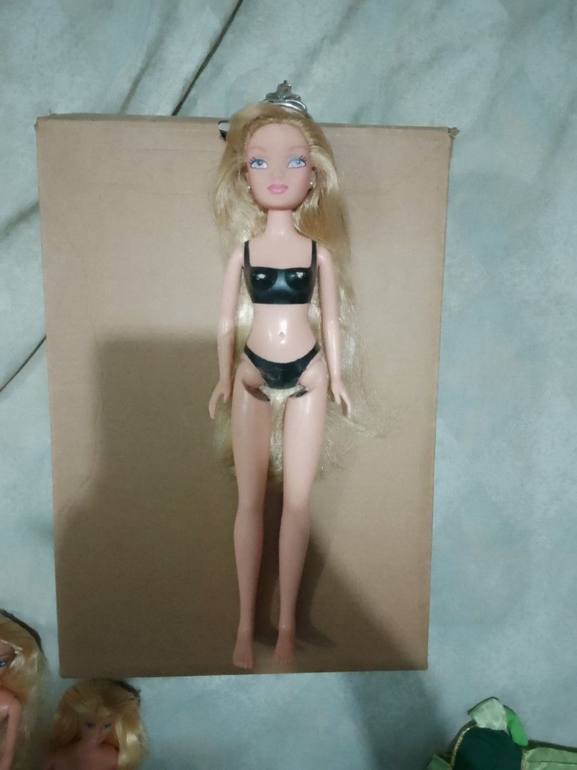 Shrek Princesses Rapunzel Doll (Category: Kids Toys) located in Davao. Submitted by sassykumi (Listing ID 1467032600, Image 2). Description: Includes her original earrings and crown with a princess dress. Only flaws are pink marks on her legs..