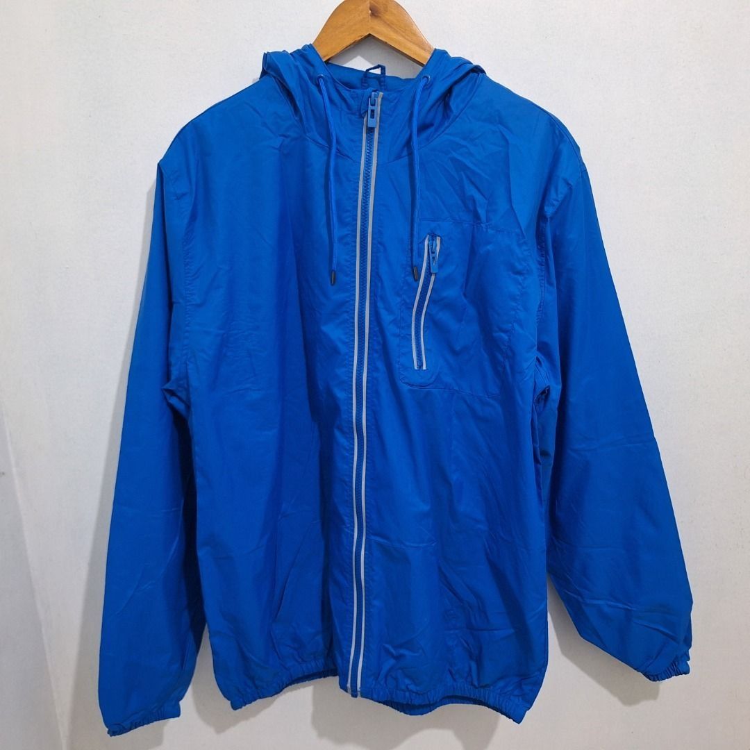 PREOWNED Simply Basic Blue Hooded Windbreaker Jacket EG (Category: Coats, Jackets and Outerwear) located in Manila. Submitted by blackhaven98 (Listing ID 1467053856, Image 1). Description: - Brand: Simply Basic - Size: EG - Color: Bright blue - Features: Full zip front, attached hood with drawstrings, zipper pockets on chest and sides - Material: Lightweight and easy to pack - Condition: Clean inside and out, perfect for outdoor runs and breezy d