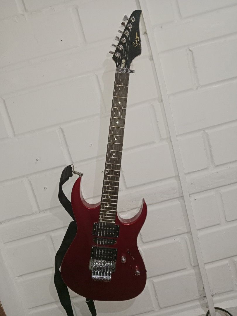 Singer Red Electric Guitar (Category: Musical Instruments) located in Taguig. Submitted by jikoob.art (Listing ID 1467116062, Image 1). Description: Selling my Singer electric guitar. Has minor issues and some parts that needed replacement. Free iRig for guitar recording included. Slightly negotiable. RFS: Di na ginagamit. Sira-sira na din guitar case nya. .