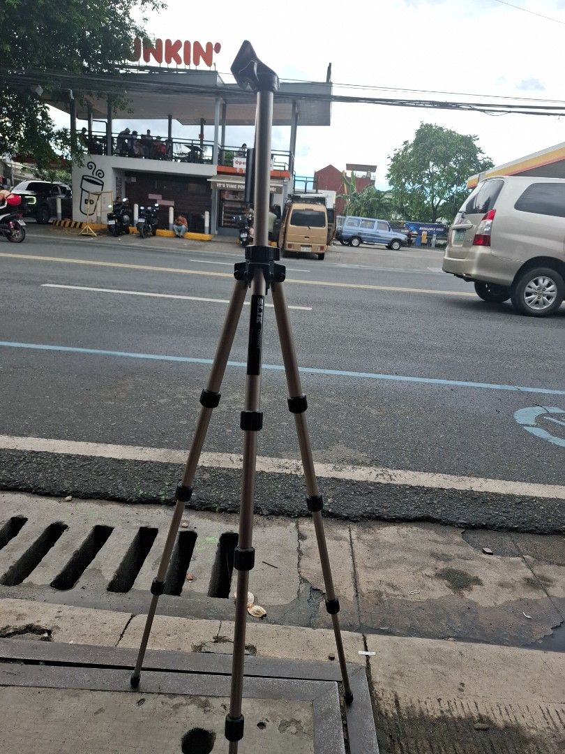 Slik Compact Tripod (Category: Tripods & Monopods) located in Manila. Submitted by rocksolid227 (Listing ID 1467027697, Image 1). Description: - Brand/Model: Slik Compact Tripod - Material: Lightweight aluminum build - Compatibility: Fits most cameras and phones with a standard screw mount - Features: Adjustable legs with multiple height sections and a smooth pan head - Portability: Folds down small for easy carrying - Condition: Normal signs of 