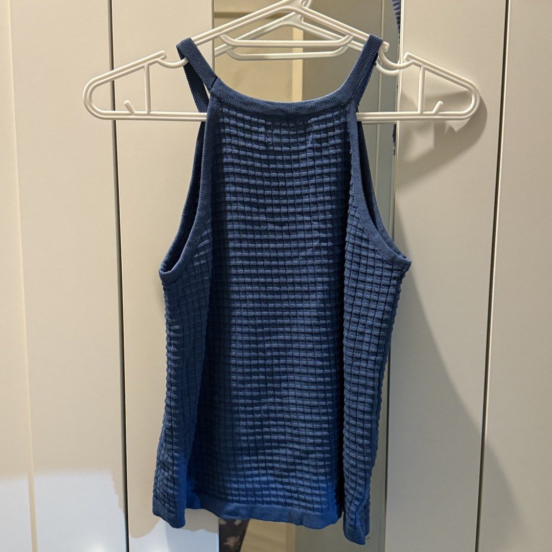 Small to Medium Blue Knit Halter Neck Tank Top (Category: Sleeveless) located in Marikina City. Submitted by lovegoeson (Listing ID 1467001485, Image 2). Description: - Brand: SEEMHAM - Style: Halter neck tank top - Material: Textured waffle knit, stretchy and snug fit - Color: Blue - Condition: Clean, no flaws - Features: Sleeveless, high neckline, great for layering or warm weather.
