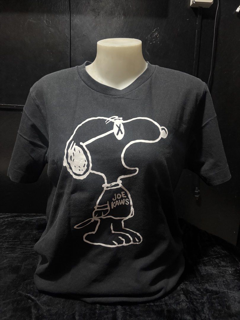 Snoopy Shirt (Category: Shirts) located in Pasig City. Submitted by dealwithgia (Listing ID 1467154951, Image 1). Description: Kaws peanuts Medium Size 8/10 condition.