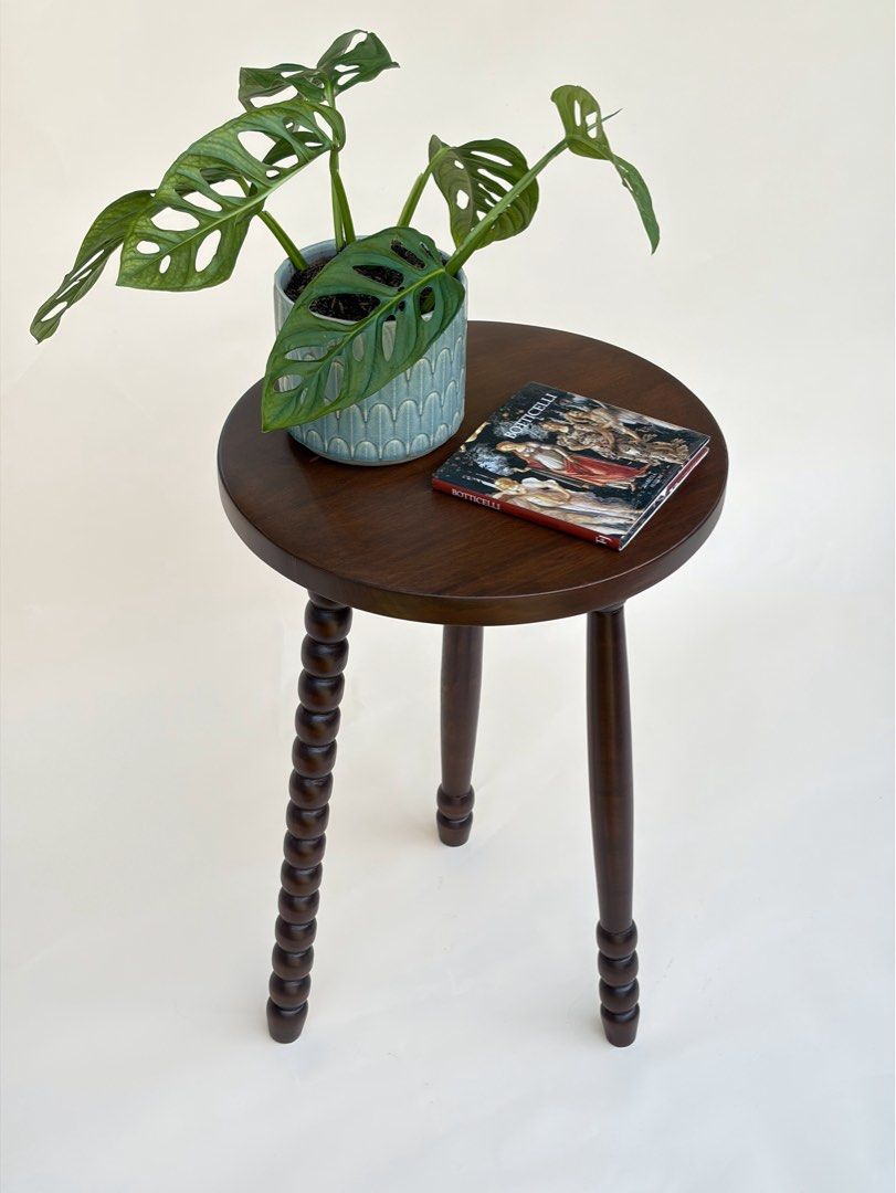 Solid Mahogany Round Accent Side Table with Mismatched Turned Spindle Legs (Category: Tables & Sets) located in Paranaque City. Submitted by match.box (Listing ID 1467087827, Image 1). Description: - Solid Mahogany - Dark Brown Stain in Matte Finish - Features three mismatched turned legs - Smooth, flat top surface Dimensions: - Diameter: 40cm - Height: 61cm - Versatile use: ideal as a small side table or plant stand - Clean finish that easily ma