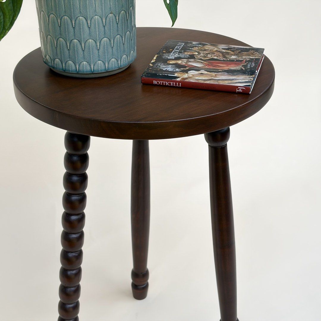 Solid Mahogany Round Accent Side Table with Mismatched Turned Spindle Legs (Category: Tables & Sets) located in Paranaque City. Submitted by match.box (Listing ID 1467087827, Image 3). Description: - Solid Mahogany - Dark Brown Stain in Matte Finish - Features three mismatched turned legs - Smooth, flat top surface Dimensions: - Diameter: 40cm - Height: 61cm - Versatile use: ideal as a small side table or plant stand - Clean finish that easily ma