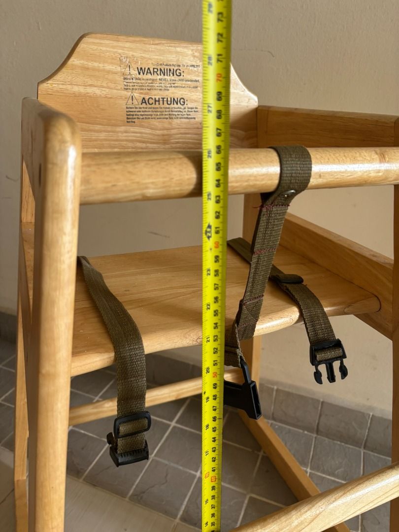 Solid Wood High (Category: Kids' Tables & Chairs) located in Subang Jaya. Submitted by justusername1234567 (Listing ID 1467013618, Image 3). Description: Preloved solid wood kids’ high chair with safety straps. Sturdy design, natural wood finish, and easy to clean. Suitable for toddlers, with secure buckles to keep your child safe during mealtime. Height arond 70 cm.