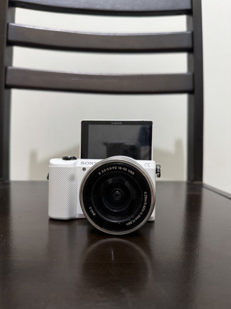 Sony A5000 Mirrorless Camera with 16-50mm Lens White (Category: Cameras) located in Las Pinas. Submitted by james_fh6 (Listing ID 1466971966, Image 2). Description: Sony Alpha A5000 Mirrorless Camera Inclusions: Unit Itself Sony 16-50mm OSS Lens 2x Batteries: Original + Replacement (USB-C Charging) Original Charger All Working Flash is working AF is working 7,xxx SC Minor Lens Fungus, does not affect images Issues: Dents, scrapes, and scratches (