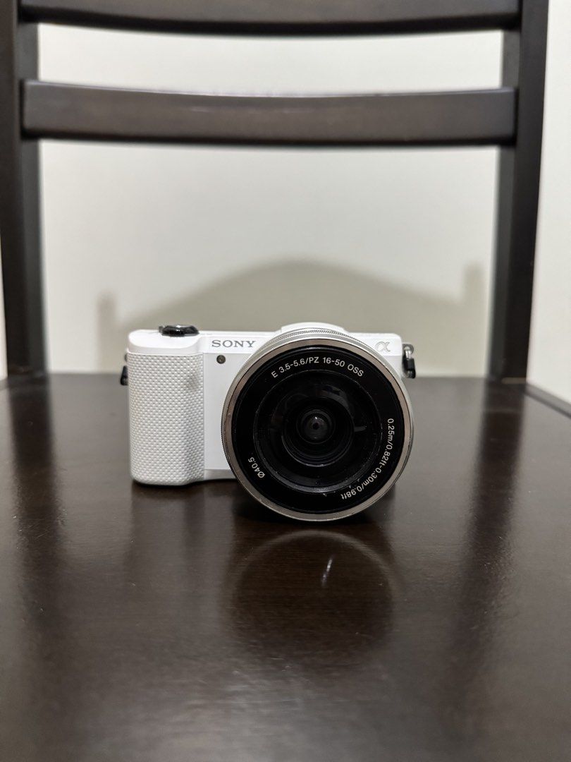 Sony A5000 Mirrorless Camera with 16-50mm Lens White (Category: Cameras) located in Las Pinas. Submitted by james_fh6 (Listing ID 1466971966, Image 1). Description: Sony Alpha A5000 Mirrorless Camera Inclusions: Unit Itself Sony 16-50mm OSS Lens 2x Batteries: Original + Replacement (USB-C Charging) Original Charger All Working Flash is working AF is working 7,xxx SC Minor Lens Fungus, does not affect images Issues: Dents, scrapes, and scratches (