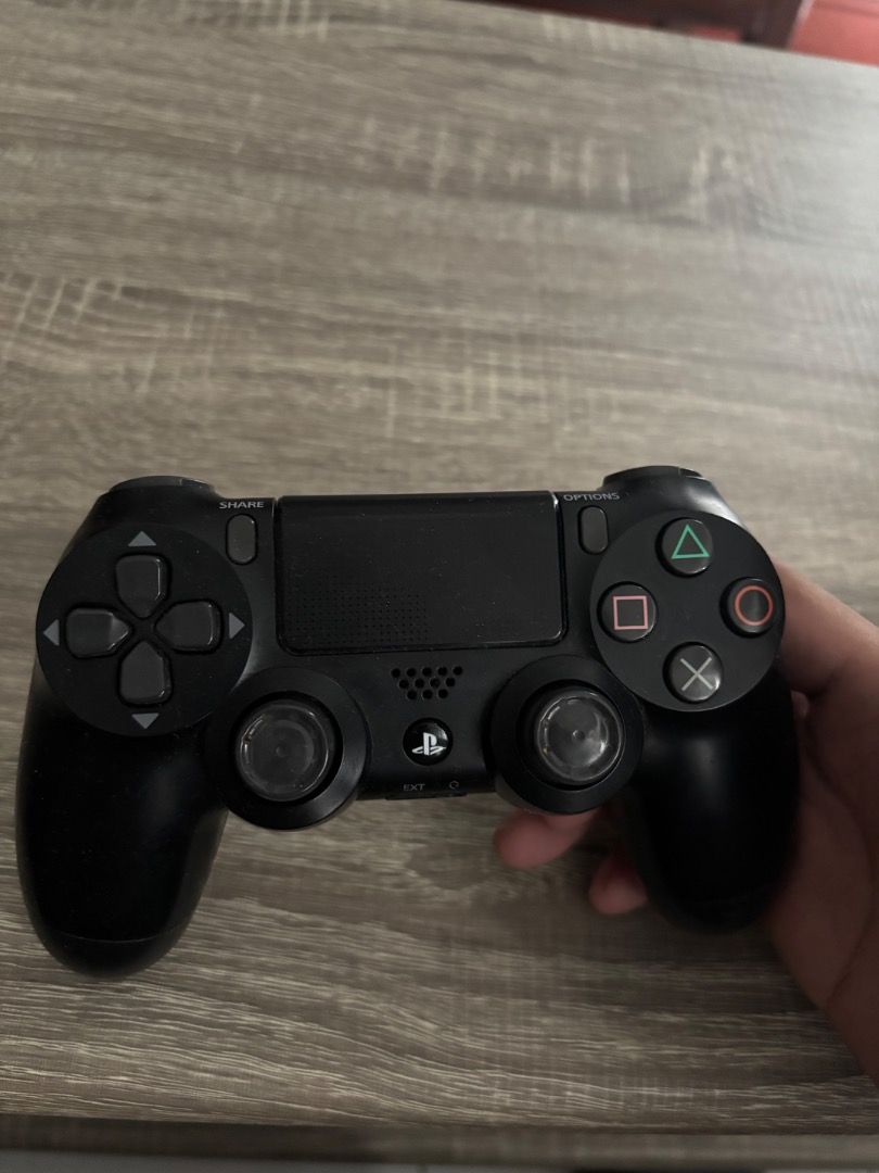 Sony PlayStation 4 DualShock 4 Wireless Controller Black (Category: Controllers) located in Paranaque City. Submitted by joaquinjoseph (Listing ID 1467041060, Image 3). Description: - Item: Sony PlayStation 4 Wireless Controller (Black) - Layout: Standard DualShock 4 with analog sticks, d-pad, and action buttons - Condition: Fully functional regular gamepad - Features: Standard charging port and headphone jack on the bottom - Ideal for: Adding an