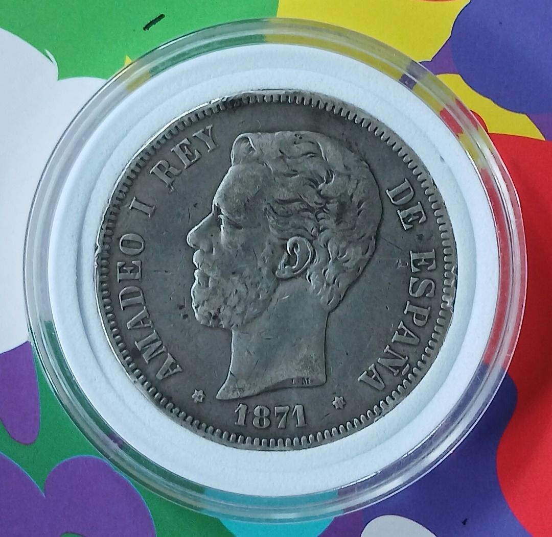 Spain 5 Pesetas 1871 Silver Coin (Category: Currency) located in Quezon City. Submitted by allaboutcollectibles (Listing ID 1467010404, Image 1). Description: What you see is what you get. Issuer: Spain Year: 1871 Value: 5 Pesetas Composition: Silver (.900) Weight: 25 g Diameter: 37 mm Thickness: 2 mm This coin is guaranted genuine, thank you for visiting my store..