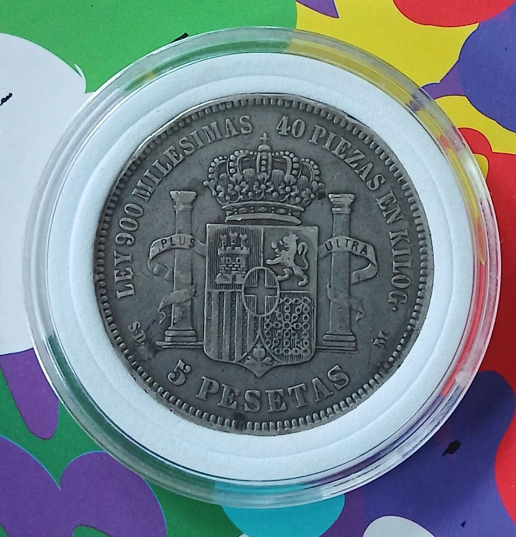 Spain 5 Pesetas 1871 Silver Coin (Category: Currency) located in Quezon City. Submitted by allaboutcollectibles (Listing ID 1467010404, Image 2). Description: What you see is what you get. Issuer: Spain Year: 1871 Value: 5 Pesetas Composition: Silver (.900) Weight: 25 g Diameter: 37 mm Thickness: 2 mm This coin is guaranted genuine, thank you for visiting my store..