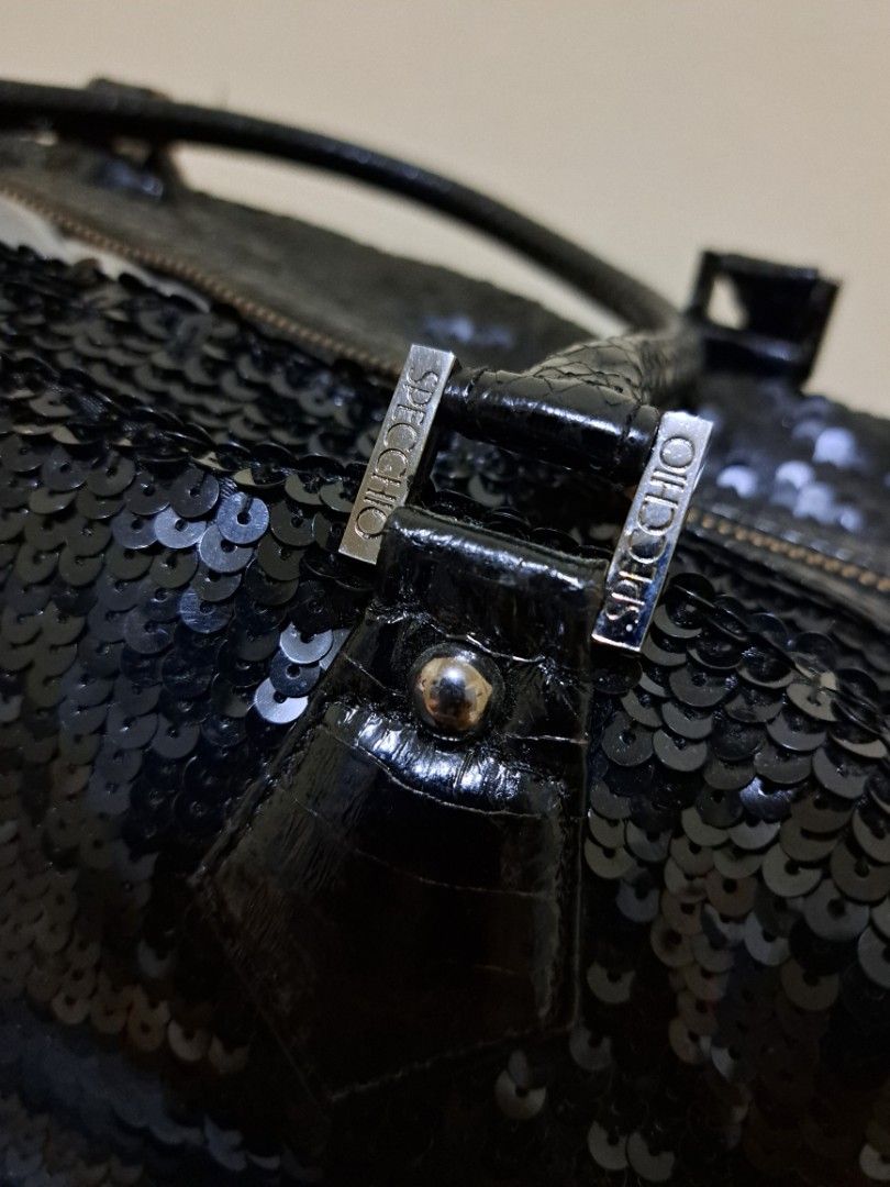 SPECCHIO Black Sequin Handbag (Category: Luxury Bags & Wallets) located in Cebu City. Submitted by piakrisia (Listing ID 1467022637, Image 3). Description: Approx. Measurements - Length: 17inches, Width: 5.5 inches, Height: 10 inches, Strap: 18.5 inches - Brand: SPECCHIO - Color: Black with all-over shiny sequins - Material: Sequin exterior with black textured leather trim and top handles - Closure: Secure top zipper closure - Interior: Dark fabr