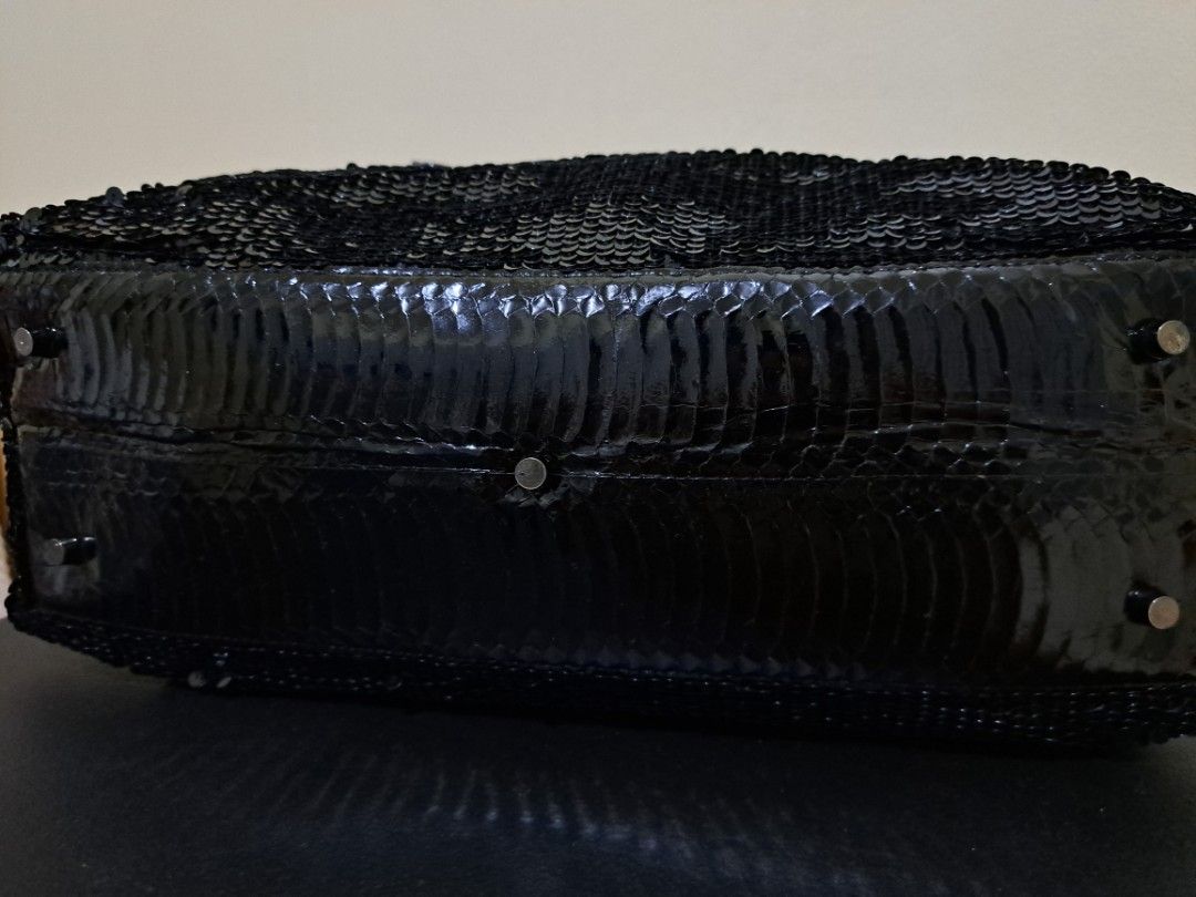 SPECCHIO Black Sequin Handbag (Category: Luxury Bags & Wallets) located in Cebu City. Submitted by piakrisia (Listing ID 1467022637, Image 2). Description: Approx. Measurements - Length: 17inches, Width: 5.5 inches, Height: 10 inches, Strap: 18.5 inches - Brand: SPECCHIO - Color: Black with all-over shiny sequins - Material: Sequin exterior with black textured leather trim and top handles - Closure: Secure top zipper closure - Interior: Dark fabr