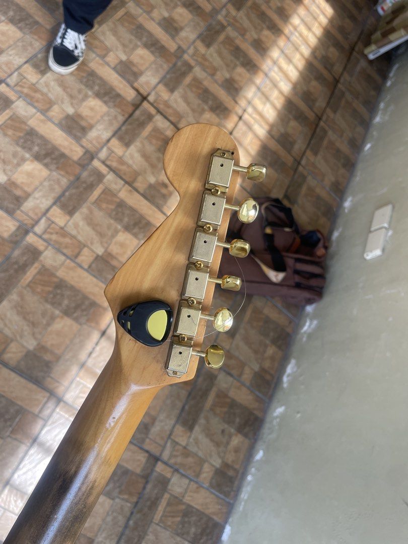 SQUIER SUNBURST STRATOCASTER (Category: Musical Instruments) located in Cavite. Submitted by gabriel20022006 (Listing ID 1467007289, Image 3). Description: wala nang SRV sticker!!! gold na lahat ng hardwares relic neck aftermarket with guitar bag location: tanza cavite.
