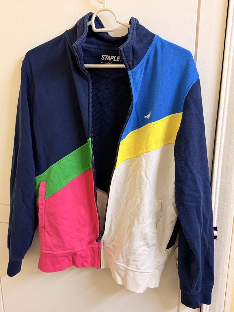 Staple Pigeon Colorblock Zip-Up Track Jacket Size M (Category: Coats, Jackets and Outerwear) located in Manila. Submitted by lanzblade (Listing ID 1467063597, Image 1). Description: - Size: Medium - Design: Bold colorblock (Blue, yellow, white, green, pink, and navy panels) - Features: Stand collar, full zip closure, ribbed cuffs and hem - Material: Soft cotton blend - Condition: Clean, excellent, and ready to wear.