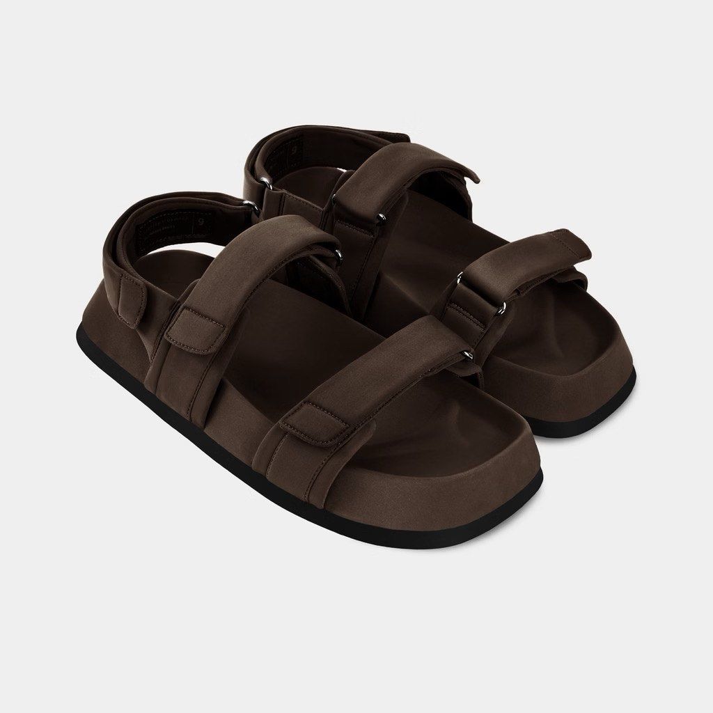 Straightforward Kieran Sandals (Category: Slippers & Slides) located in Agdangan. Submitted by reece.style (Listing ID 1467012201, Image 1). Description: Keiran Sandals embody the spirit of exploration, crafted for the modern wanderer who values both comfort and style. Crafted in NeoPlush, it offers an unparalleled wearing experience. Accented with a gunmetal triangle and featuring an easy Velcro closure, these sandals are your steadfast companio