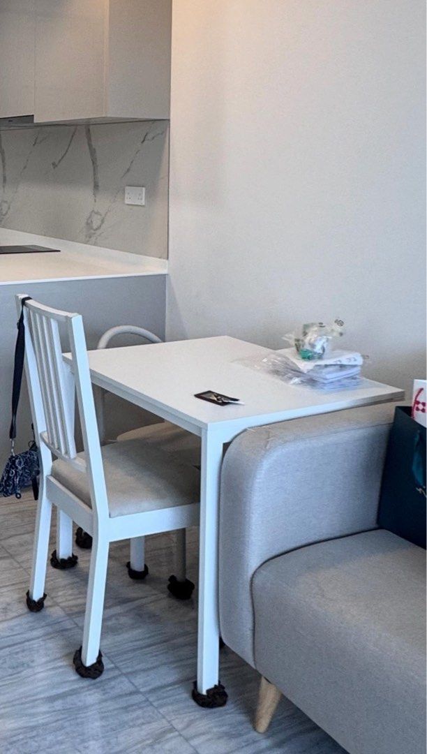 Study dining table (Category: Tables & Sets) located in Singapore. Submitted by hashb (Listing ID 1467079814, Image 1). Description: - Compact white dining table with matching chairs - Padded seats for extra comfort - Leg protectors included to prevent floor scratches - Ideal size for small spaces and HDB kitchens - Clean, neutral design that matches any interior - Reason for sale: Moving out - Collection method: Pick up only.
