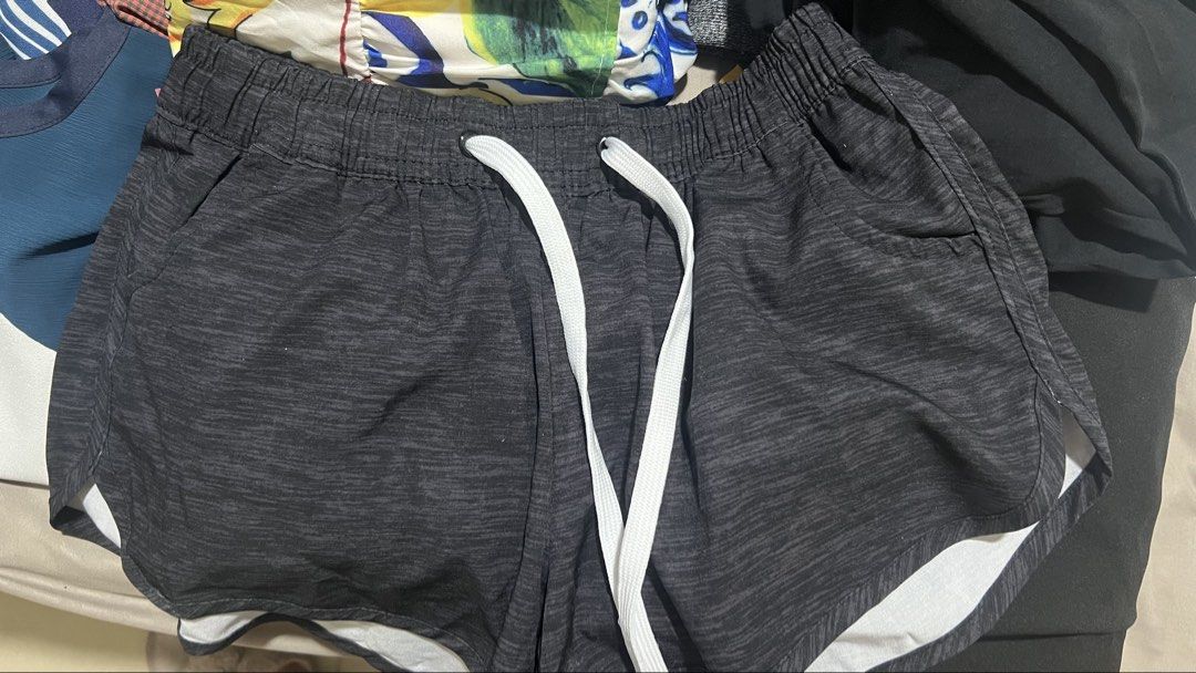 Sunesand Athletic Shorts Black Size M (Category: Shorts) located in Taguig. Submitted by xkmanzano078817 (Listing ID 1467107491, Image 1). Description: - Brand: Sunesand - Color: Dark grey and black marl with contrasting white inner lining - Size: Medium (tag attached) - Waistband: Elastic with a thick white drawstring - Material: Lightweight and breathable - Ideal for: Workouts, running, or casual lounging at home Seller’s Profile Height: 5’1” W