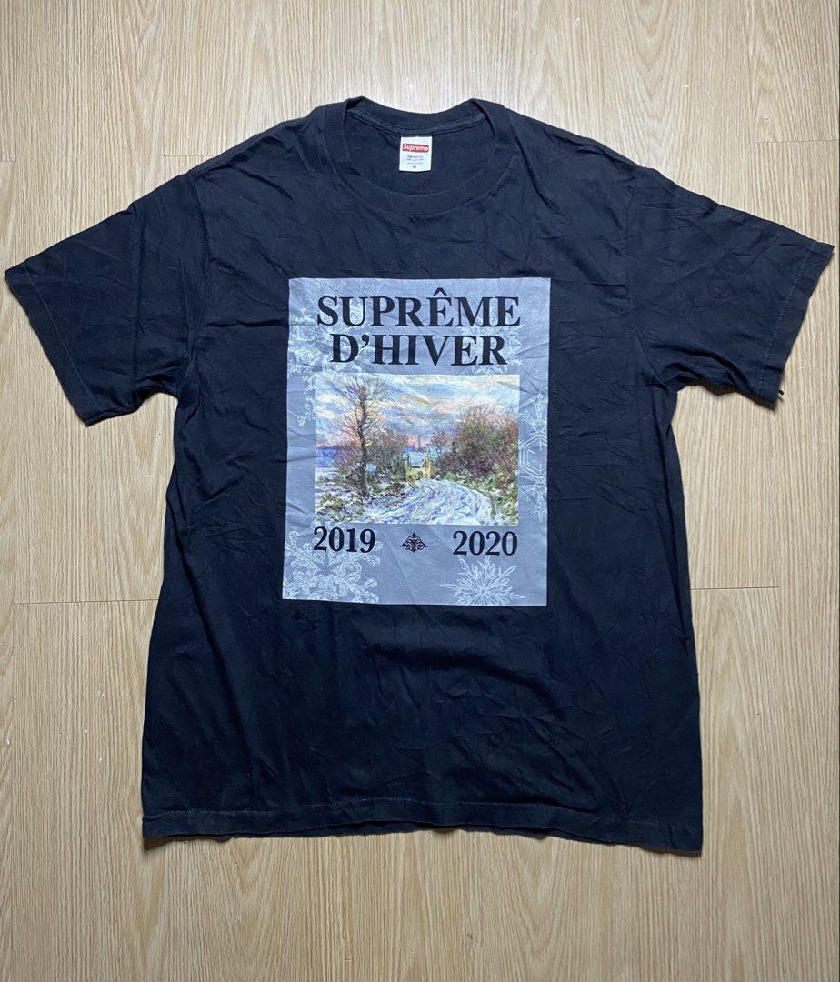 Supreme D'Hiver 2019-2020 Tee Black Medium (Category: Tshirts & Polo Shirts ) located in Olongapo. Submitted by copnsold (Listing ID 1466988471, Image 1). Description: Supreme D'Hiver graphic tee in black. Size medium. Front features landscape art print with 'Suprême D'Hiver' and '2019 - 2020' lettering. Classic fit, short sleeves, crew neck. Cotton construction with standard interior neck label and care tag intact. Pre-shrunk fabric, made in U.S