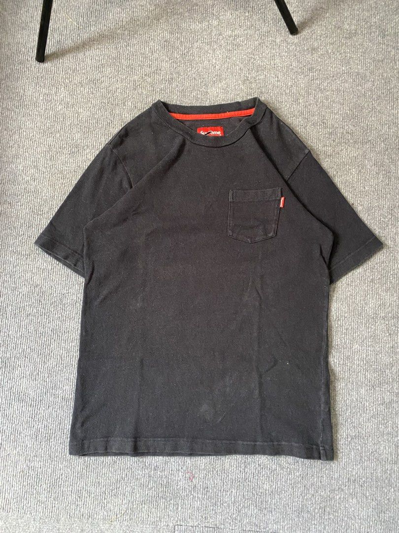 Supreme Pocket Tee Black Red (Category: Tshirts & Polo Shirts ) located in Maria Aurora. Submitted by mightypenguin.f7ca53 (Listing ID 1467101315, Image 1). Description: Supreme black cotton t-shirt with a chest pocket and red contrast neck tape. Includes small red Supreme tag on the pocket and main neck label. Size S. Note the tear in the main collar tag. Made in China. Comfortable everyday streetwear staple..