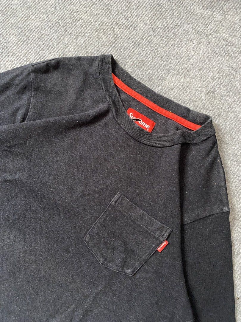 Supreme Pocket Tee Black Red (Category: Tshirts & Polo Shirts ) located in Maria Aurora. Submitted by mightypenguin.f7ca53 (Listing ID 1467101315, Image 3). Description: Supreme black cotton t-shirt with a chest pocket and red contrast neck tape. Includes small red Supreme tag on the pocket and main neck label. Size S. Note the tear in the main collar tag. Made in China. Comfortable everyday streetwear staple..