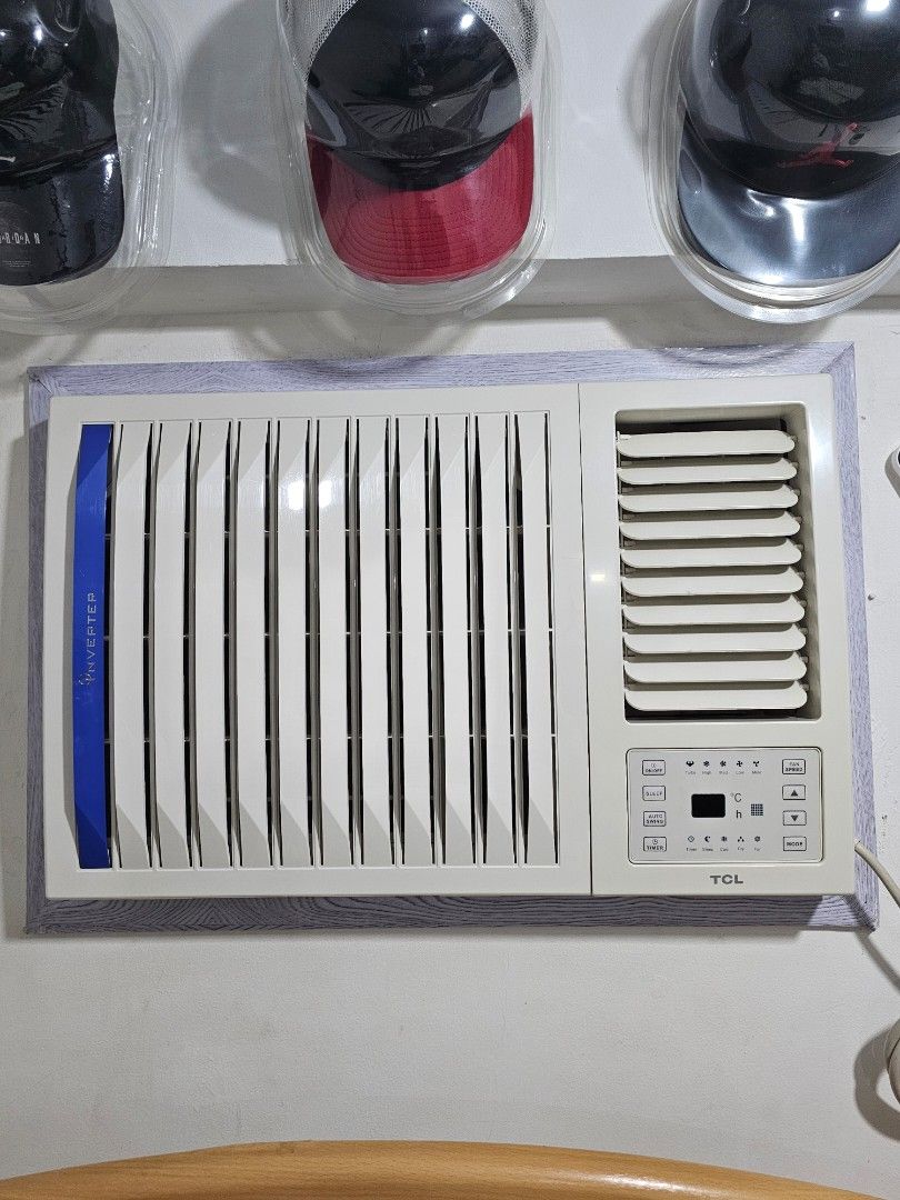 TCL Inverter Window Type Air Conditioner (Category: Air Conditioning and Heating) located in Manila. Submitted by dandredbr.955 (Listing ID 1466976608, Image 1). Description: - Brand/Model: TCL Window-Type Inverter Air Conditioner - Control Panel: Digital panel on the upper right - Design: White casing with a stylish blue accent stripe - Performance: Cools rooms exceptionally well - Condition: Currently wall-mounted, fully working, and well-maint