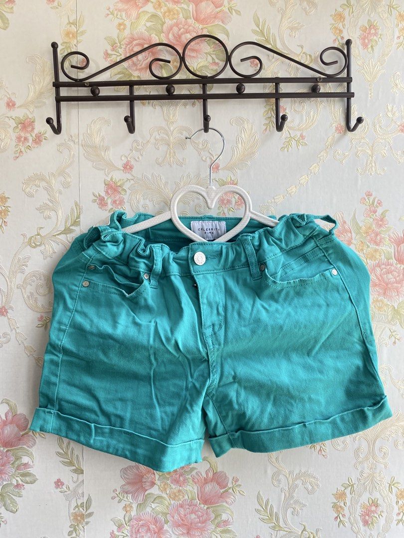 Teal Denim Cuffed Shorts (Category: Shorts) located in Bulacan. Submitted by str4wberryjj (Listing ID 1467109513, Image 1). Description: - Brand: Celebrity Pink - Color: Vibrant teal green - Style: Mid-rise denim shorts with cute ruffled elastic waistband - Details: Front scoop pockets, back patch pockets, button closure, and cuffed hems - Condition: Great pre-loved condition - Perfect for: Warm weather outfits, easily paired with basic tanks and