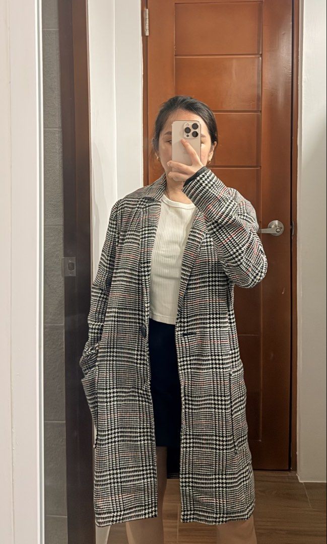 Terranova Plaid Long Coat (Category: Coats, Jackets and Outerwear) located in Santa Rosa. Submitted by cmasangkay (Listing ID 1467054938, Image 3). Description: - Brand: Terranova - Style: Outerwear coat in classic black and white plaid with subtle red stripes - Closure: Single button front - Pockets: Deep side pockets for convenience - Interior: Fully lined for comfort - Measurements: Length ~86 cm, Sleeve ~26 cm - Condition: Great layering piec