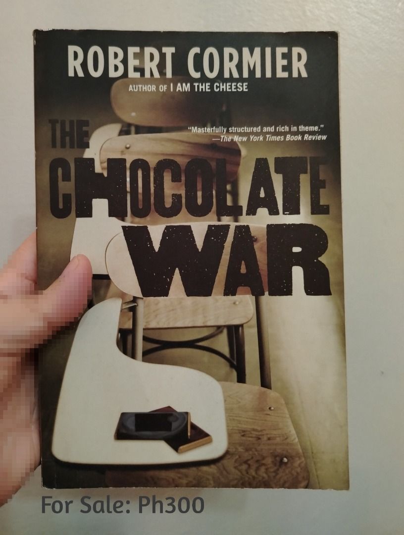 The Chocolate War by Robert Cormier paperback (Category: Storybooks) located in Pasig City. Submitted by queensoleil (Listing ID 1467013883, Image 1). Description: - Title: The Chocolate War - Author: Robert Cormier (Author of I Am The Cheese) - Genre: Classic YA Fiction - Format: Paperback - Condition: Pages intact, highly readable. With foxing. - Price: ₱300.
