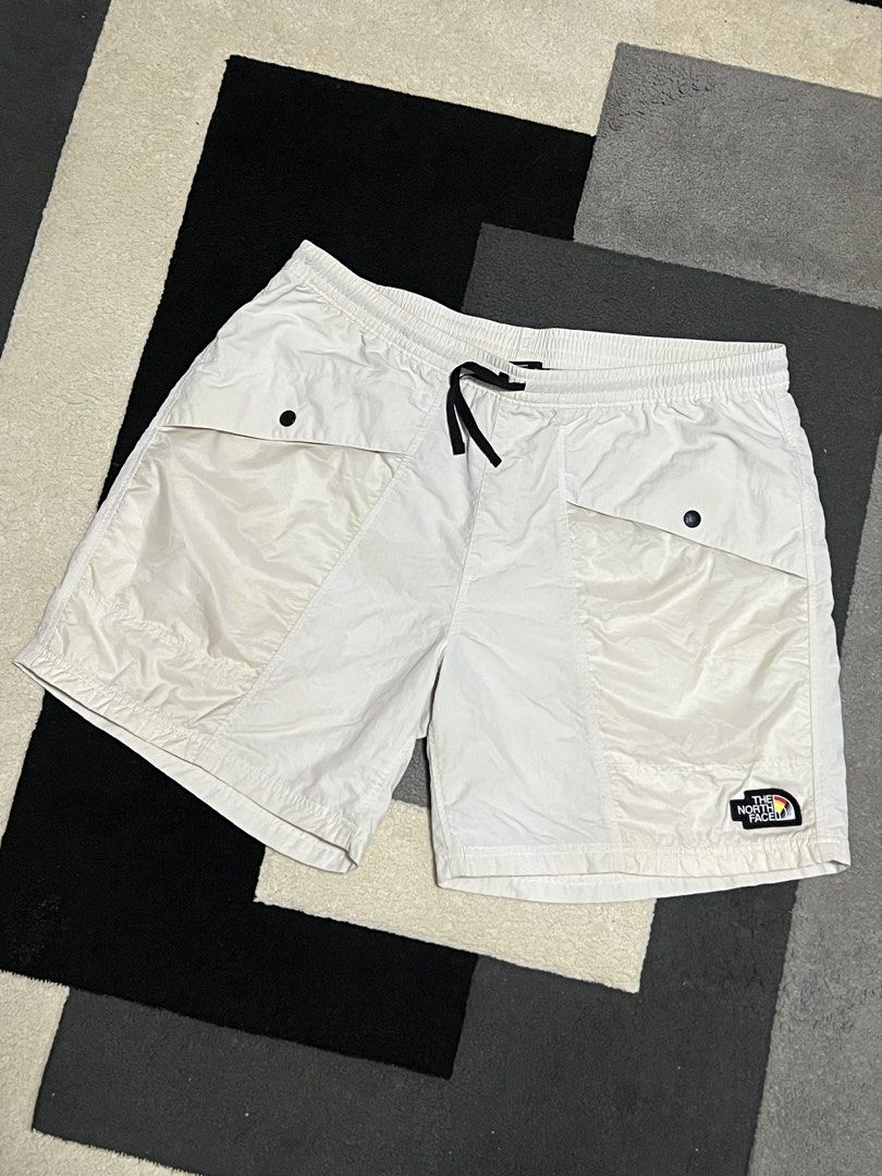 The North Face Pride Rainbow Logo Shorts White (Category: Shorts) located in Calasiao. Submitted by pb.supply_v2 (Listing ID 1467162422, Image 2). Description: - Authentic The North Face Pride collection white nylon shorts - Lightweight and breathable fabric for all-day comfort - Elastic waistband with adjustable black drawstring - Large front pockets with secure snap-button flaps - Convenient single zip pocket on the back right - Distinctive emb
