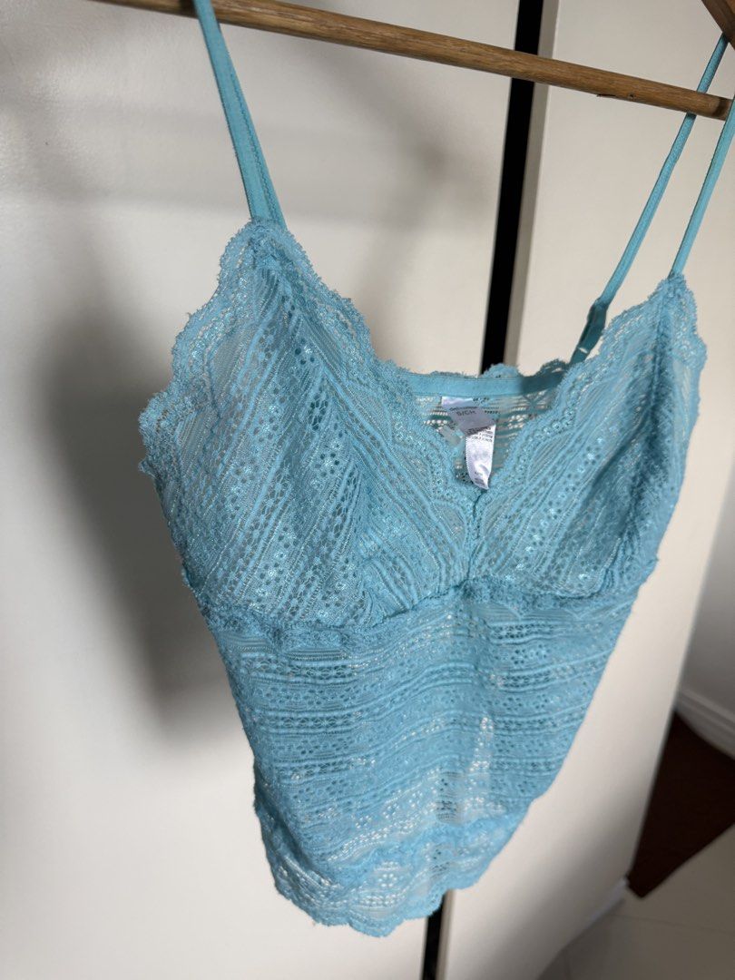Tiffany blue cami lace top (Category: Sleeveless) located in Manila. Submitted by xxxara (Listing ID 1467030303, Image 2). Description: Light blue lace cami top. Size S/CH on the tag. Double strap design with adjustable sliders. Scalloped edges along the neckline and hem. Super stretchy lace material, semi-sheer. Great color, easy to layer or wear on its own during warmer days..