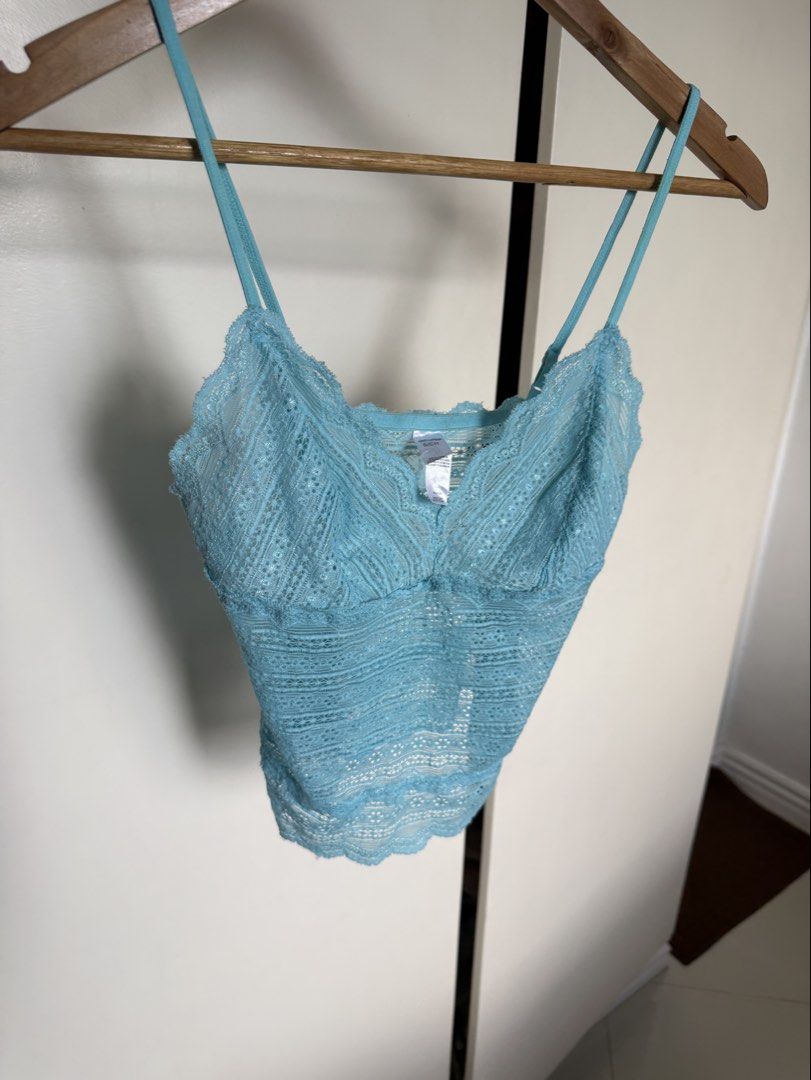 Tiffany blue cami lace top (Category: Sleeveless) located in Manila. Submitted by xxxara (Listing ID 1467030303, Image 1). Description: Light blue lace cami top. Size S/CH on the tag. Double strap design with adjustable sliders. Scalloped edges along the neckline and hem. Super stretchy lace material, semi-sheer. Great color, easy to layer or wear on its own during warmer days..