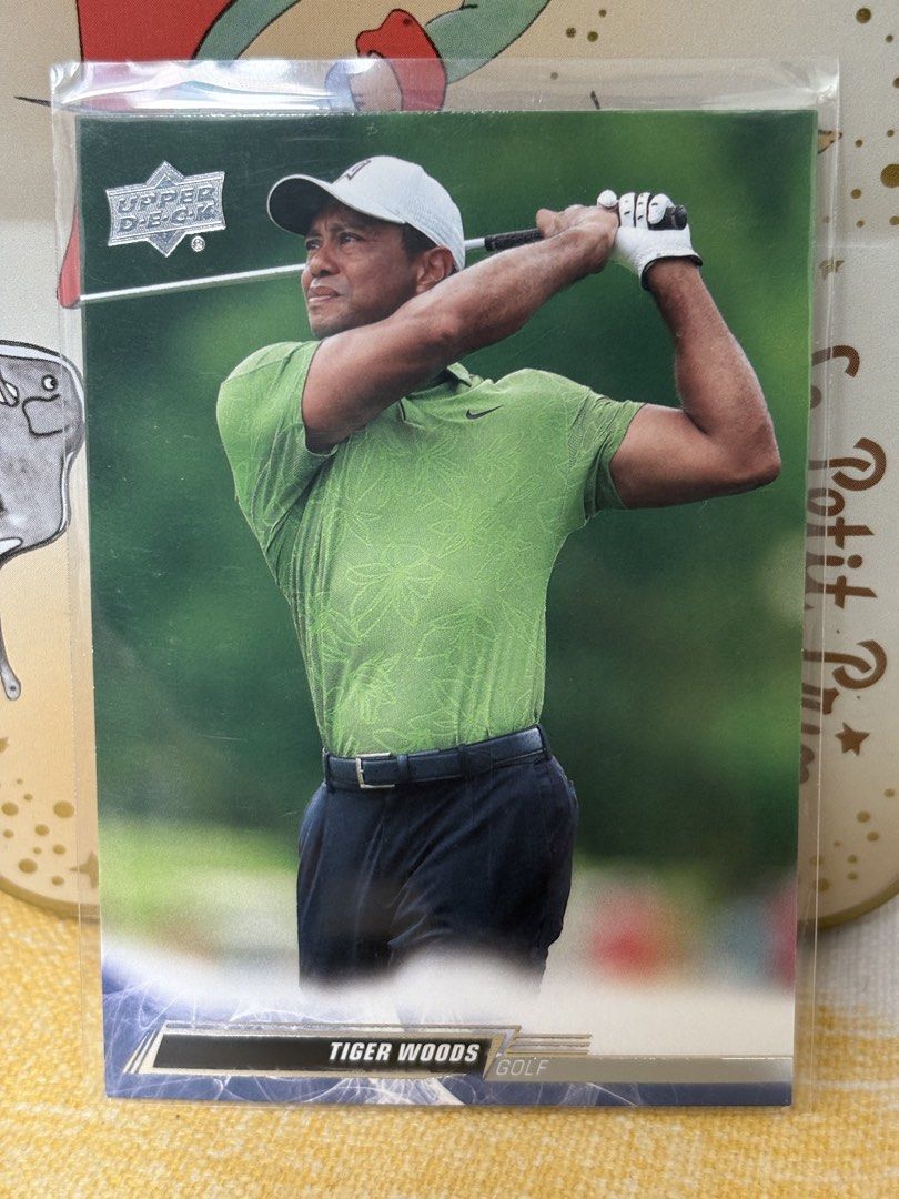 Tiger Woods (Category: Raw Singles) located in Las Pinas. Submitted by kapkards (Listing ID 1467000292, Image 1). Description: - Authentic Tiger Woods Upper Deck golf trading card - Features an action shot in his signature green polo and white cap - Stored in a clear protective sleeve since day one - Ideal addition for golf fans and sports card collectors - DM if interested!.