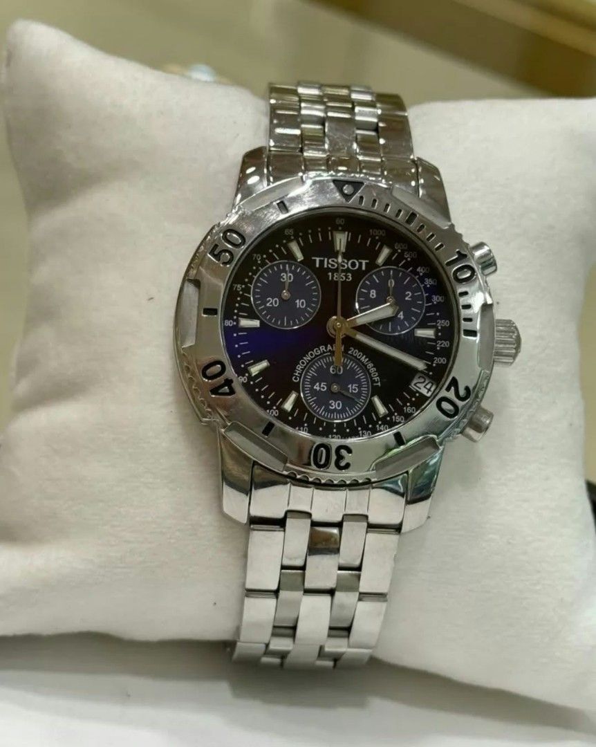 Tissot PRS 200 Chronograph Watch (Category: Luxury Watches) located in Paranaque City. Submitted by calm_youngstore7 (Listing ID 1467047831, Image 1). Description: - Authentic Tissot PRS 200 Chronograph Watch - Stunning blue dial with 3 sub-dials and date window at 4 o'clock - Durable stainless steel bracelet with Tissot logo and PRS200 engraved clasp - Rotating bezel and reliable quartz movement - Condition: Normal signs of wear on the case and 