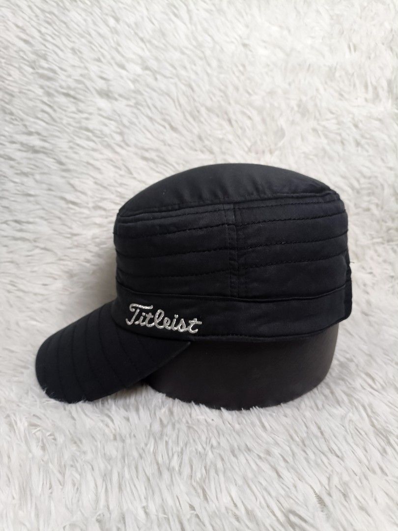 Titleist Black Military Cadet Golf Cap (Category: Caps & Hats) located in Imus. Submitted by grindhouse.thriftshop (Listing ID 1467062226, Image 2). Description: - Brand: Titleist - Style: Military-style flat top cadet hat - Color: Black with white embroidered Titleist script logo - Fit: Adjustable strap closure in the back (one size fits most) - Comfort: Built-in inner sweatband - Condition: Clean, minimal wear, excellent overall condition -Issu