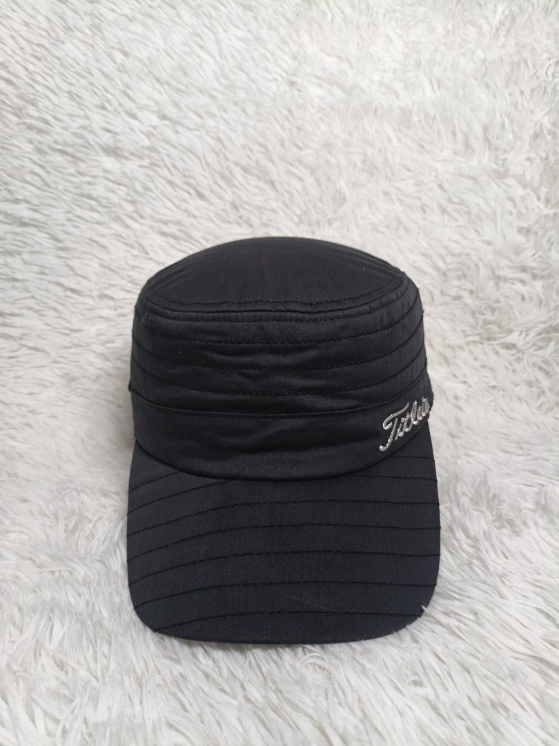 Titleist Black Military Cadet Golf Cap (Category: Caps & Hats) located in Imus. Submitted by grindhouse.thriftshop (Listing ID 1467062226, Image 1). Description: - Brand: Titleist - Style: Military-style flat top cadet hat - Color: Black with white embroidered Titleist script logo - Fit: Adjustable strap closure in the back (one size fits most) - Comfort: Built-in inner sweatband - Condition: Clean, minimal wear, excellent overall condition -Issu