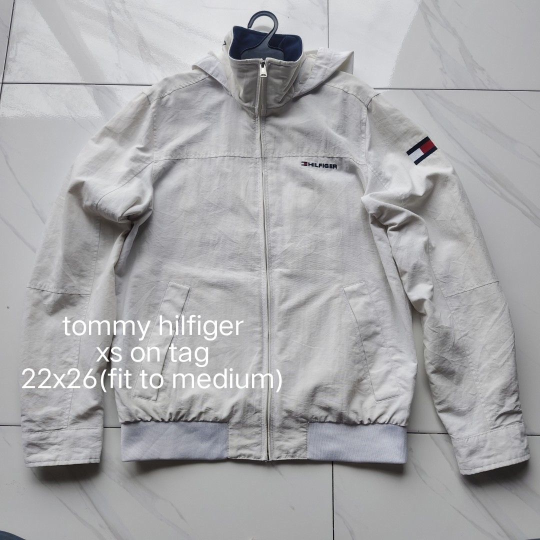 tommy hilfiger (Category: Coats, Jackets and Outerwear) located in Amadeo. Submitted by josephotep (Listing ID 1467166024, Image 1). Description: tommy hilfiger xs on tag 22x26(fit to medium) packable hood sign of usage .9/10 colorate condition 850 plus sf. loc cavite pm📥.