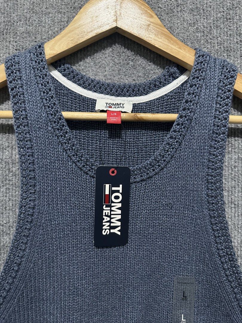 Tommy Jeans Blue Knit Tank Top (Category: Sleeveless) located in Villasis. Submitted by justinramosonfb (Listing ID 1467117331, Image 2). Description: - Brand: Tommy Jeans - Style: Knitted tank top with scoop neckline and ribbed texture - Color: Dark Blue - Size: Large - Condition: Brand new with tags (BNWT) - Material: Soft and breathable cotton blend with inner care tag.