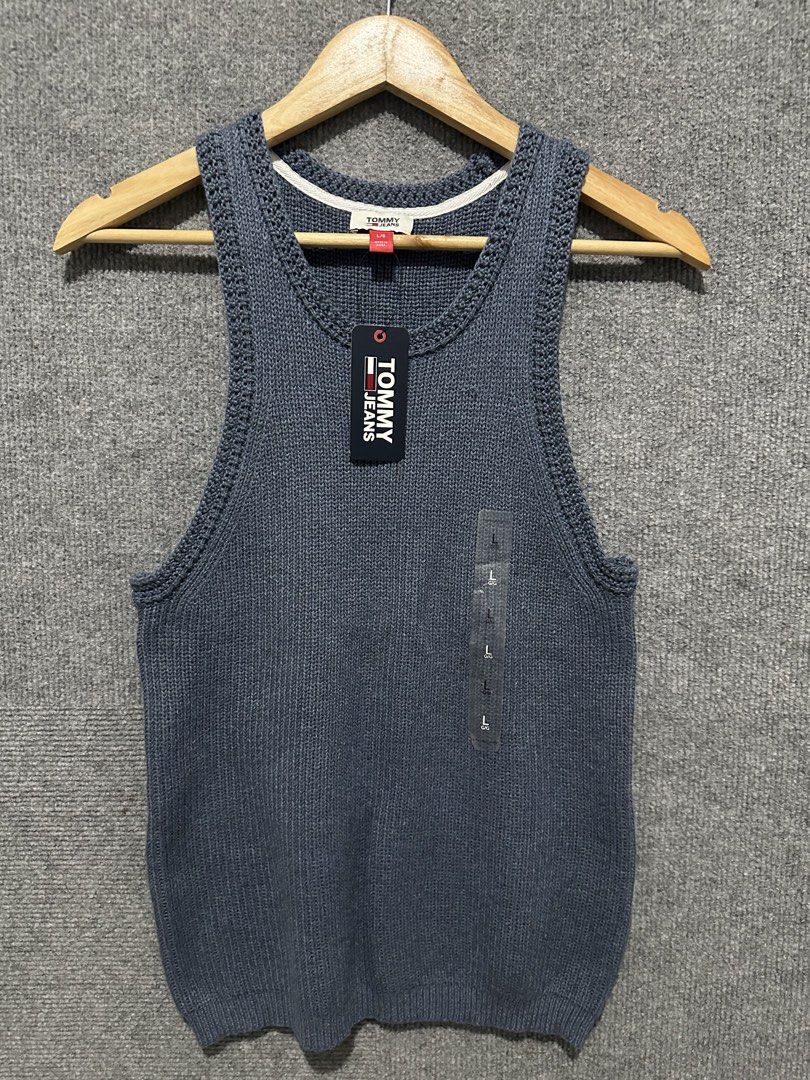 Tommy Jeans Blue Knit Tank Top (Category: Sleeveless) located in Villasis. Submitted by justinramosonfb (Listing ID 1467117331, Image 1). Description: - Brand: Tommy Jeans - Style: Knitted tank top with scoop neckline and ribbed texture - Color: Dark Blue - Size: Large - Condition: Brand new with tags (BNWT) - Material: Soft and breathable cotton blend with inner care tag.