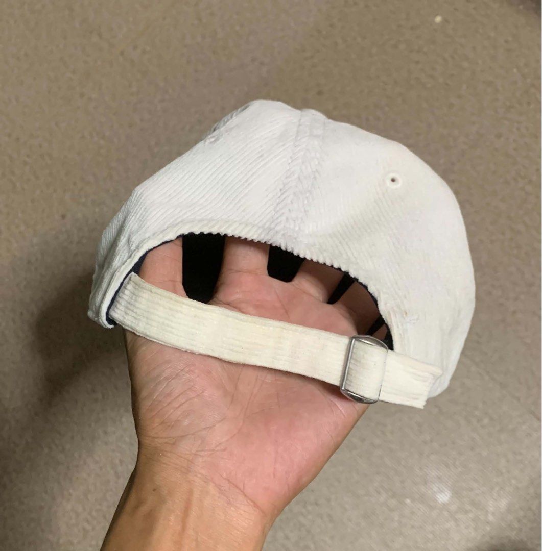 Tommy Jeans Corduroy Baseball Cap (Category: Caps & Hats) located in Tagum. Submitted by knilevinc69480 (Listing ID 1467120880, Image 3). Description: - Brand: Tommy Jeans - Material: White corduroy - Design: Embroidered logo on the front - Fit: Adjustable metal strap in the back (One Size Fits All tag attached) - Details: Branded interior tape - Condition: Clean and ready to wear.