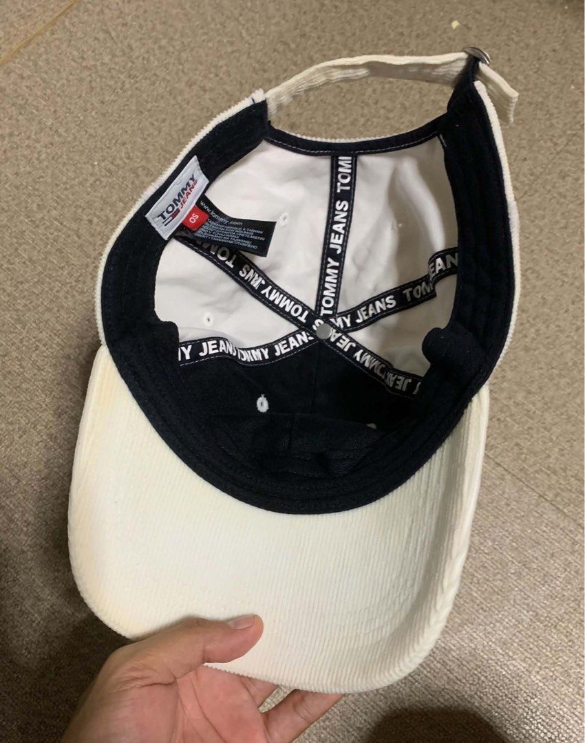 Tommy Jeans Corduroy Baseball Cap (Category: Caps & Hats) located in Tagum. Submitted by knilevinc69480 (Listing ID 1467120880, Image 2). Description: - Brand: Tommy Jeans - Material: White corduroy - Design: Embroidered logo on the front - Fit: Adjustable metal strap in the back (One Size Fits All tag attached) - Details: Branded interior tape - Condition: Clean and ready to wear.