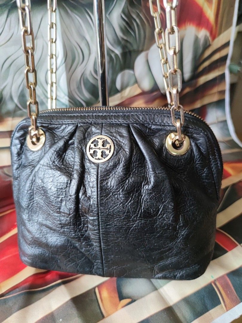 Tory Burch Black Distressed Leather Convertible chain Bag (Category: Luxury Bags & Wallets) located in Dagupan City. Submitted by jhazrightshop (Listing ID 1467057160, Image 2). Description: - Brand: Tory Burch - Material: Premium black crinkled leather with gold-tone hardware - Design: Slouchy pleated front and back panels with prominent front logo medallion - Straps: Double chain straps with leather guards for comfortable shoulder wear - Closur