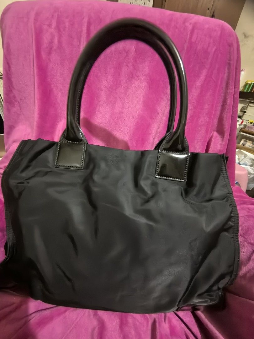 Tory Burch Black Nylon Tote Bag (Category: Tote Bags) located in Manila. Submitted by jsu2026 (Listing ID 1467097097, Image 3). Description: Authentic Tory Burch Ella Patent Nylon Tote Bag - Black (Excellent Condition) Description: Selling my authentic Tory Burch Ella Tote Bag in classic black nylon with glossy patent leather trim. This is the large size, perfect as a daily work bag, school tote, or a lightweight travel carry-on that easily fits 