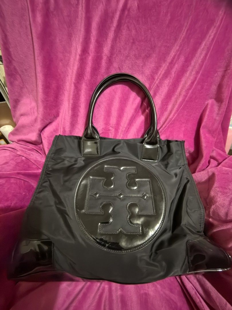 Tory Burch Black Nylon Tote Bag (Category: Tote Bags) located in Manila. Submitted by jsu2026 (Listing ID 1467097097, Image 1). Description: Authentic Tory Burch Ella Patent Nylon Tote Bag - Black (Excellent Condition) Description: Selling my authentic Tory Burch Ella Tote Bag in classic black nylon with glossy patent leather trim. This is the large size, perfect as a daily work bag, school tote, or a lightweight travel carry-on that easily fits 