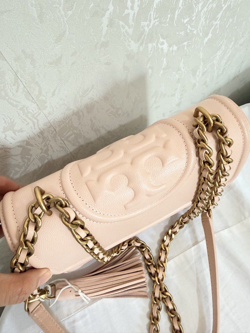 Tory Burch Fleming Quilted Leather Convertible Shoulder Bag Pink (Category: Luxury Bags & Wallets) located in Cebu City. Submitted by cutexoxoshop (Listing ID 1466973213, Image 3). Description: - Brand: Tory Burch - Color: Soft pink - Material: Quilted leather with diamond pattern - Hardware: Heavy antique brass - Features: Embossed double T logo, flap closure, and leather tassel charm - Strap: Chain strap with leather shoulder guard for shoulder