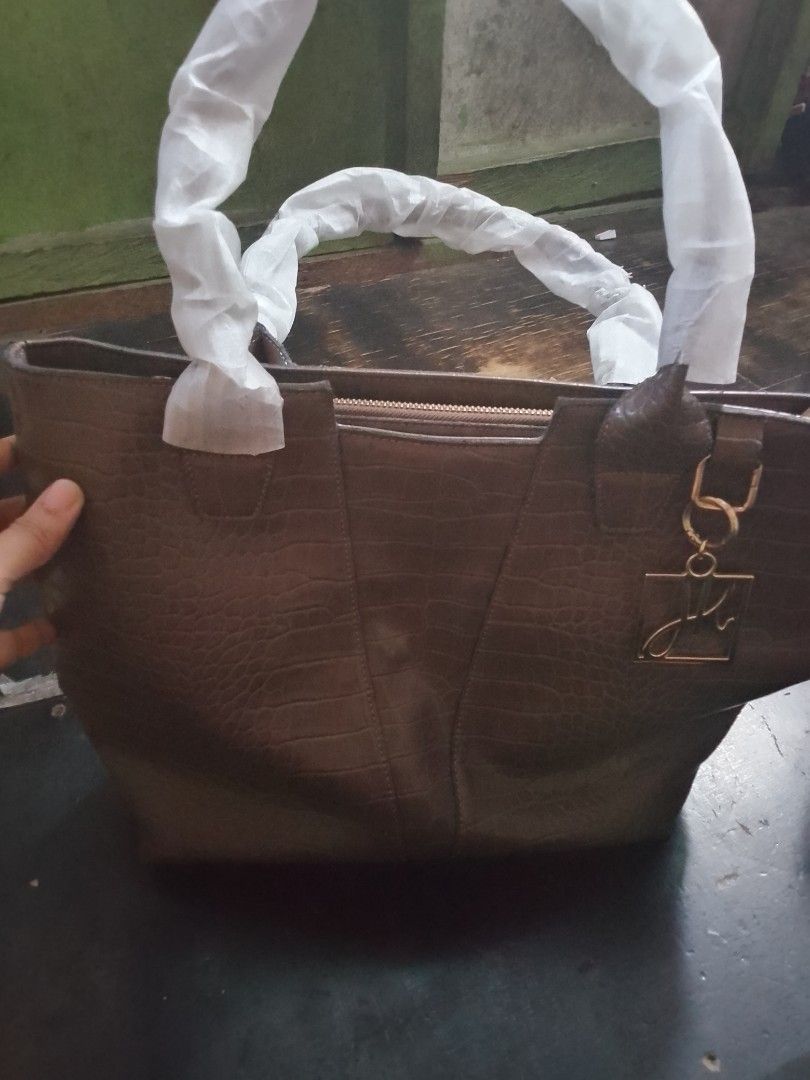 Tote bag Joseph ribbkoff (Category: Luxury Bags & Wallets) located in Manila. Submitted by livedeer.b106a0 (Listing ID 1467067352, Image 2). Description: Selling my authentic Joseph Ribkoff designer bag. • Brand: Joseph Ribkoff (Premium Canadian Designer Brand) • Condition: Pre-loved, in good condition. • Inclusions: Bag only with dust bag/strap). • Reason for Selling (RFS): Decluttering/Hindi nagagamit.
