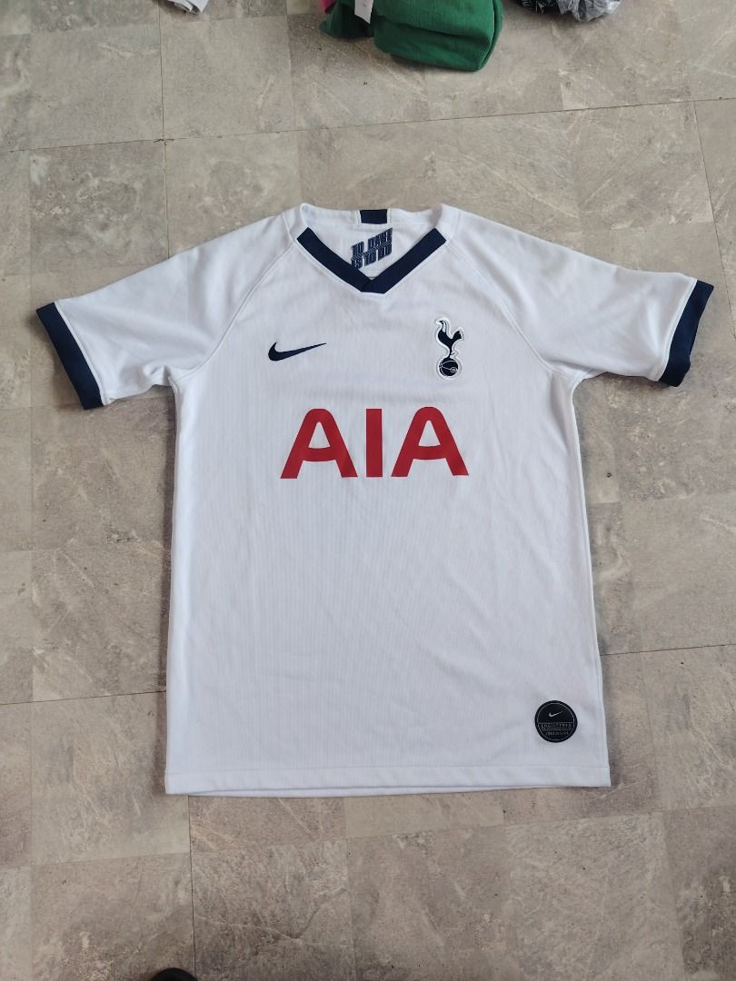 Tottenham Hotspur Home Jersey Nike AIA (Category: Activewear) located in Dasmarinas. Submitted by clydegallo40531 (Listing ID 1467038229, Image 1). Description: - Authentic Tottenham Hotspur home jersey - Classic white design with navy blue collar and sleeve cuffs - AIA sponsor logo across the chest - Embroidered Nike swoosh and Spurs crest - Official Nike authentic tag near bottom hem - Short sleeve design, perfect for match days or casual wear 