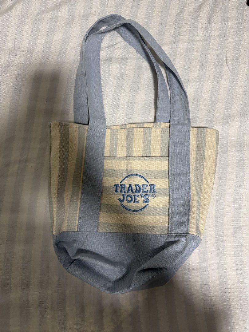 Trader Joe's Striped Mini Canvas Tote Bag (Category: Tote Bags) located in Davao. Submitted by billytings (Listing ID 1467045682, Image 1). Description: Brand: Trader Joe's Color: Blue USED ONCE; GIFTED AS PASALUBONG FROM 🇺🇸‼️ Disclaimer: minimal stains; can be washed (refer to the 5th and 6th picture)✨ Refer to the Trader Joe's website for further details on the bag .