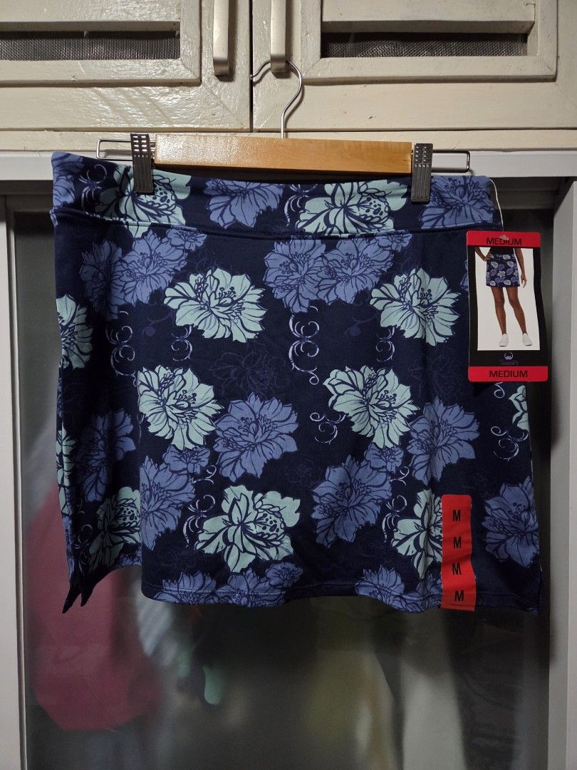 Tranquility Floral Athletic Skort Medium (Category: Activewear) located in Pasig City. Submitted by ldcayas (Listing ID 1467083204, Image 1). Description: - Brand: Tranquility by Colorado Clothing - Condition: Brand new with tags (BNWT) - Size: Medium - Color/Pattern: Navy blue with light blue floral print - Material: 92% polyester, 8% spandex - Features: Built-in shorts underneath for added comfort and coverage - Ideal for: Workouts, running, or